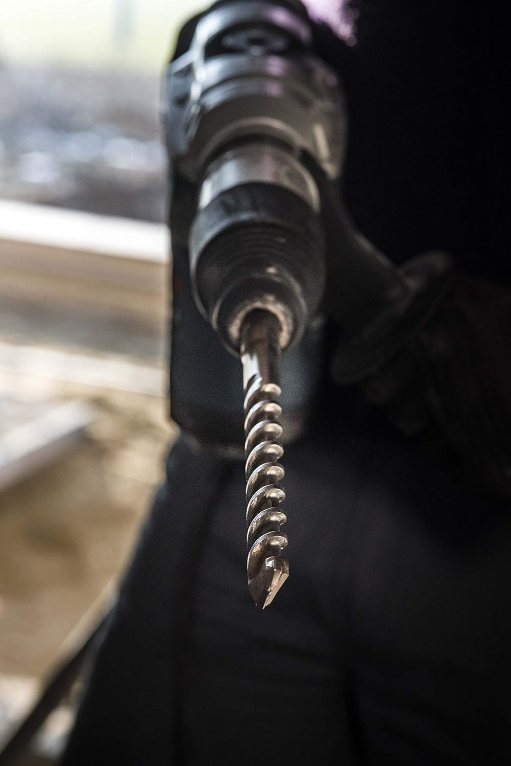 A drill bit installed in a machine holder